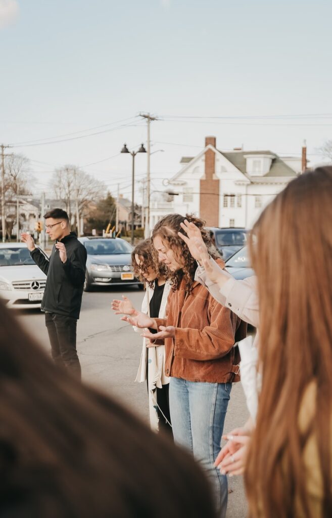 Building the Church- one person at a time, Growing God's Kingdom, woman in white long sleeve shirt standing beside woman in black coat